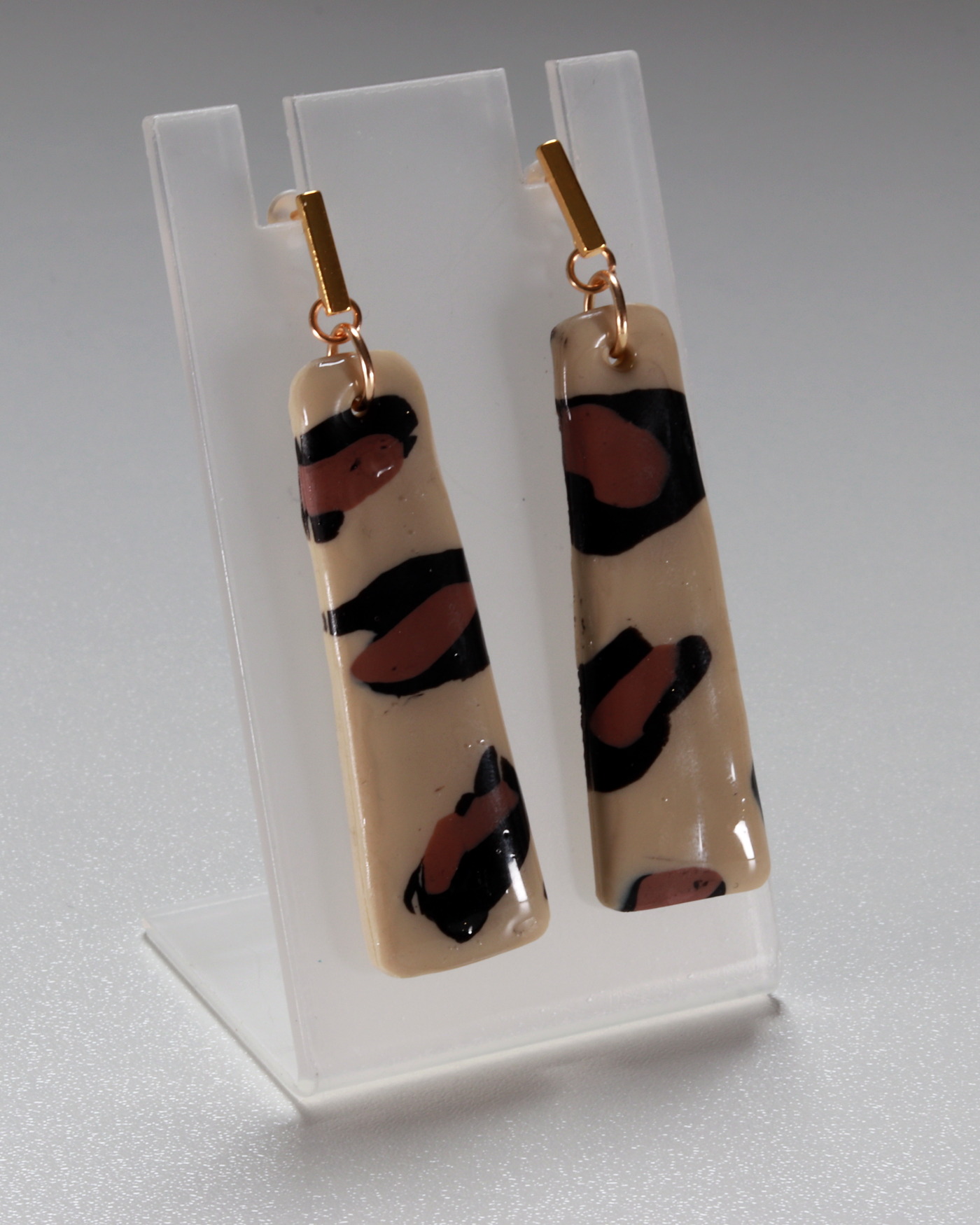 Leopard print statement earrings in a tall editorial crop