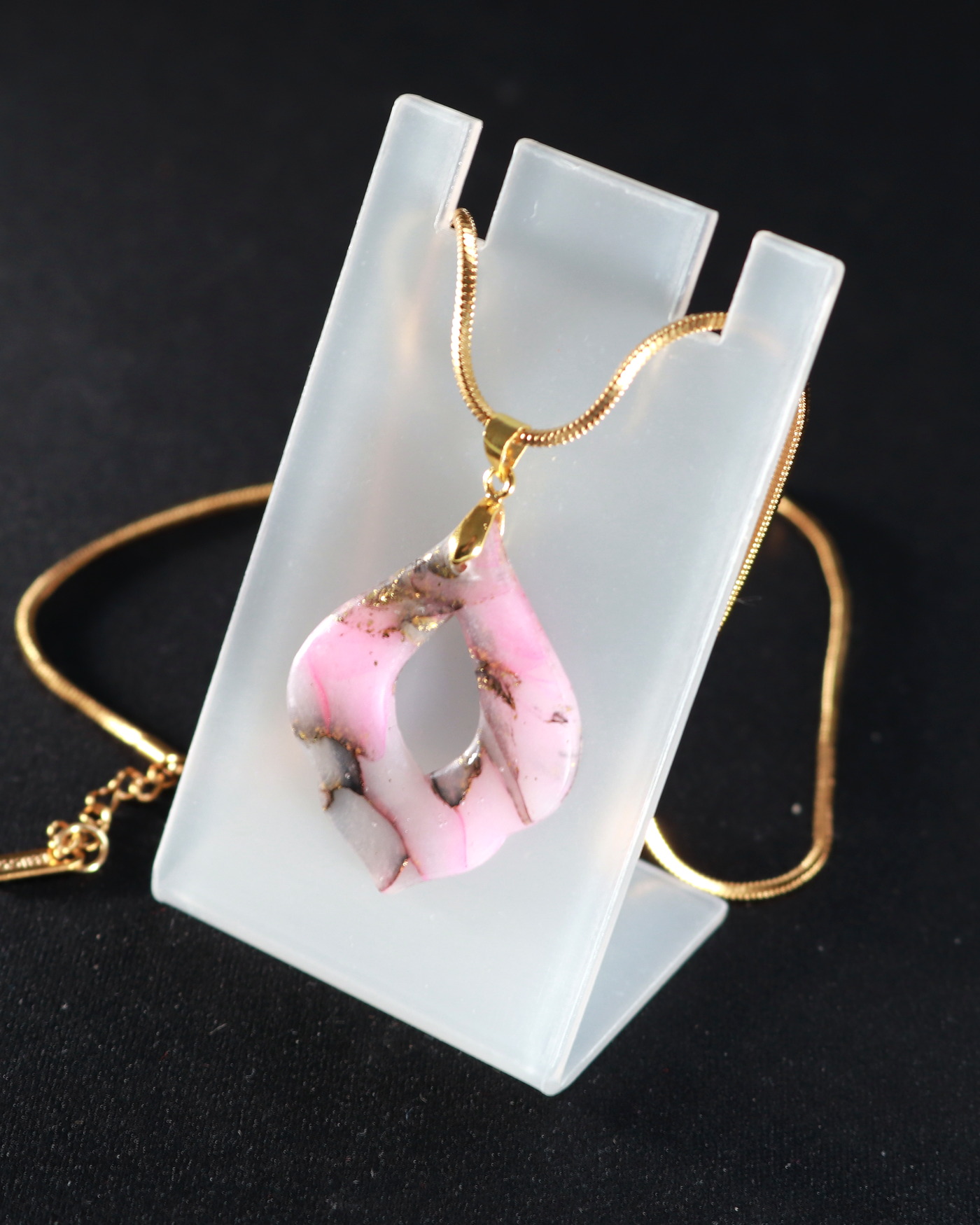 Rose smoke pendant necklace in a flowing detail crop